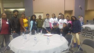 Young people serving Thanksgiving dinner at Convention Center